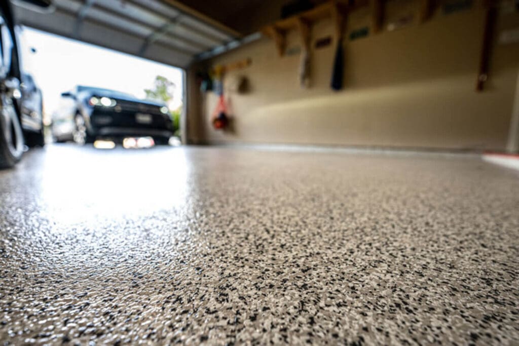 Epoxy garage floor coating with decorative flake finish in a residential garage in Santa Rosa, CA