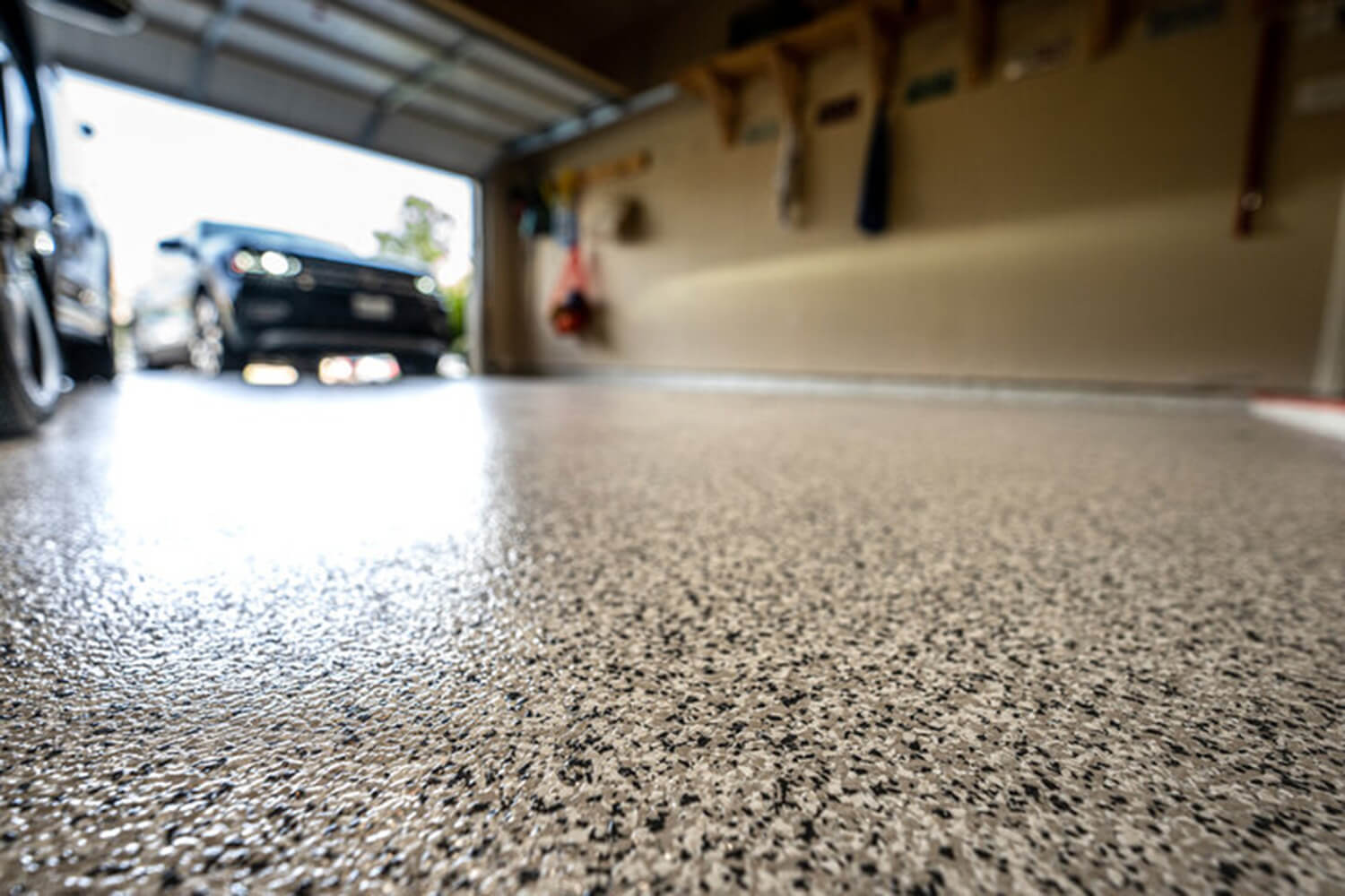 Epoxy garage floor coating with decorative flake finish in a residential garage in Santa Rosa, CA