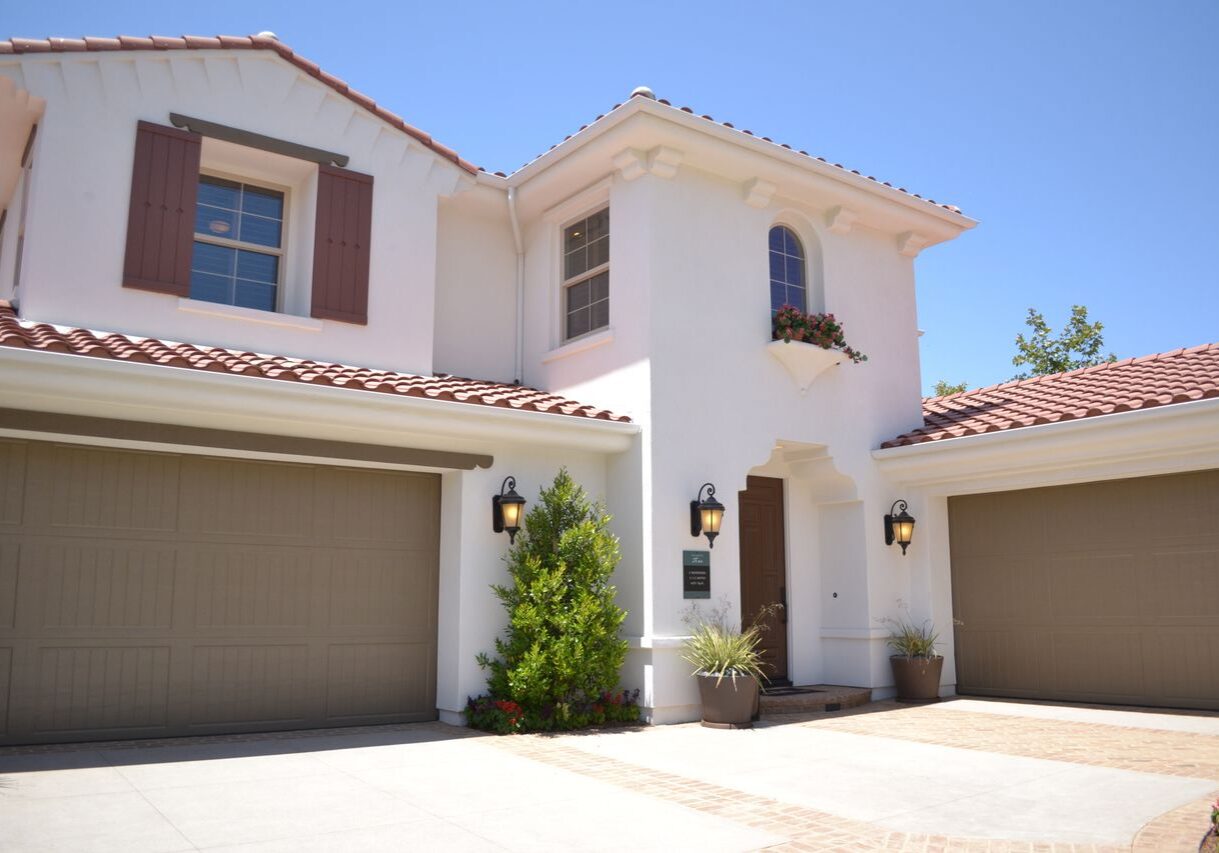 Mediterranean-style home with white stucco exterior and tile roof professionally painted in Santa Rosa, CA